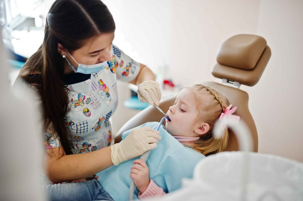Pediatric dentistry specialist in Bangalore treating a child with gentle, child-friendly dental care in Hennur
